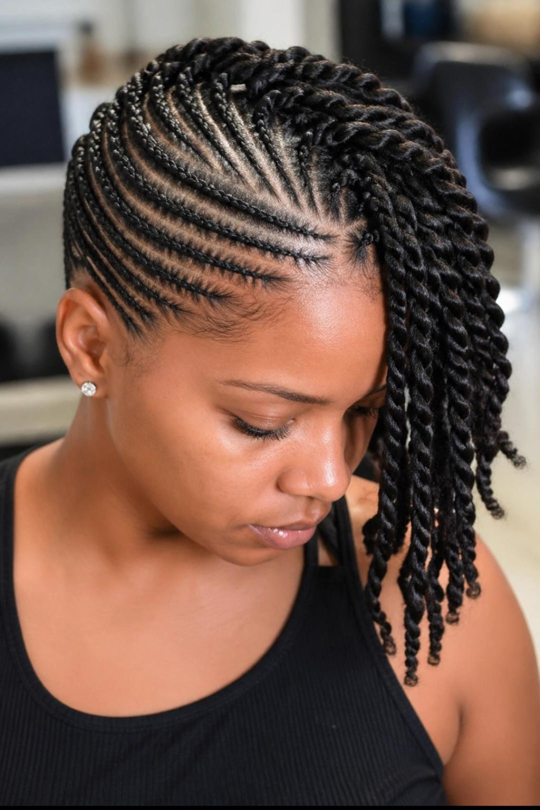 Feed-in cornrows styled into twists by Joy Braiding in Duluth, GA